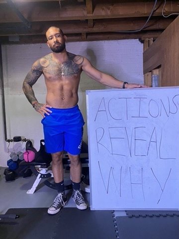 Eddie beside a whiteboard that reads Actions reveal why